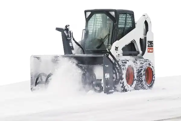 Snow Blowing with a skid steer in Winnipeg Manitoba